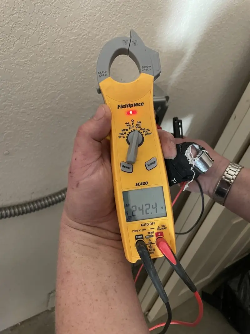 Voltage testing with clamp meter during Electrical Installation Services in Warrensville Heights
